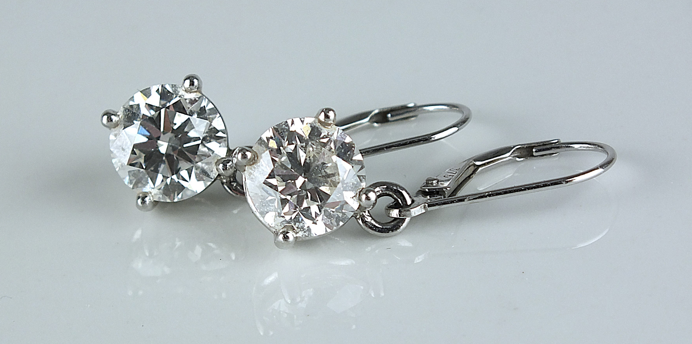This pair of brilliant cut diamond earrings sold for £10,000. Halls Fine Art